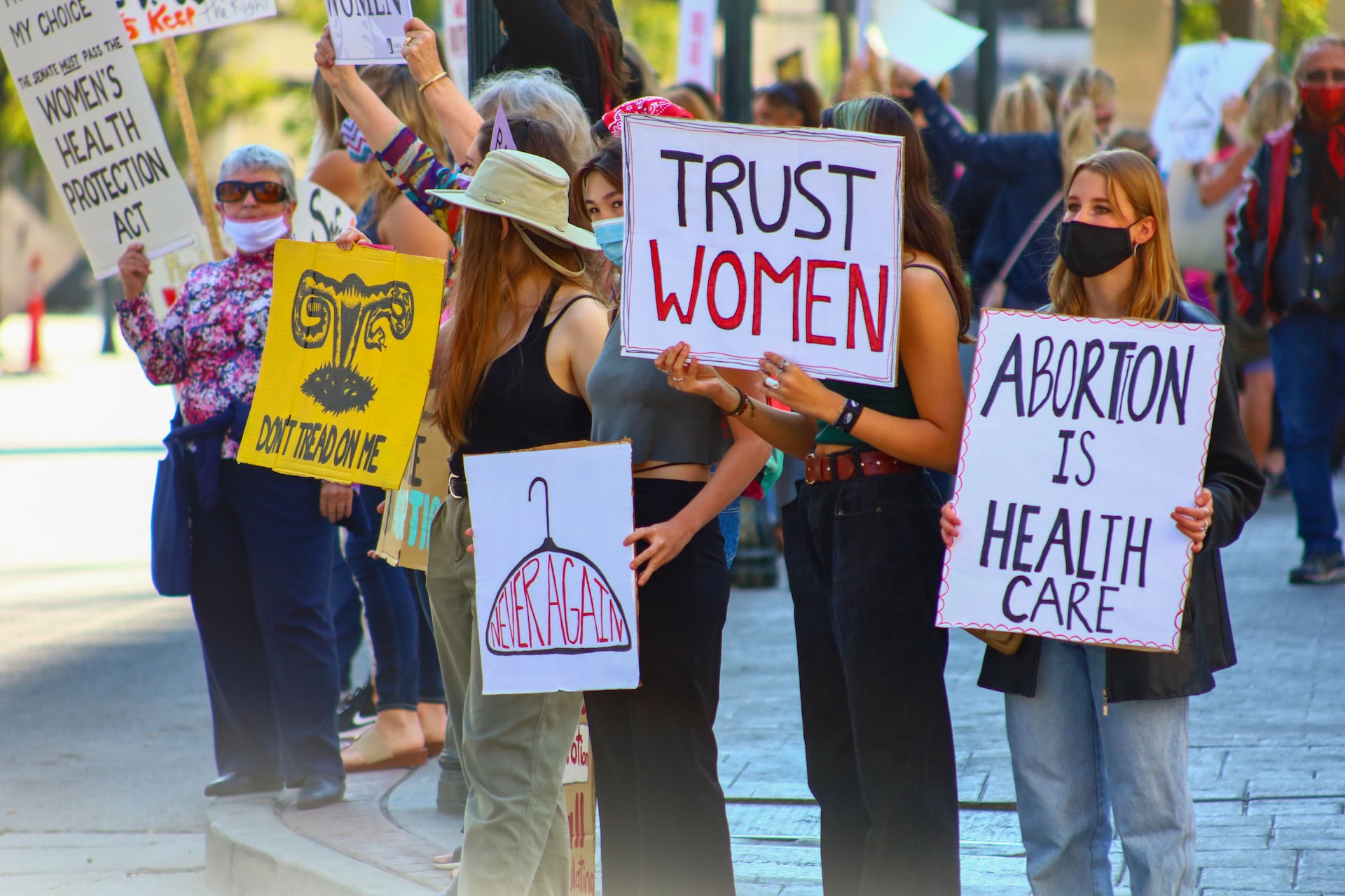 Female members of abortion abortion-rights movements protest on the streets with their placards