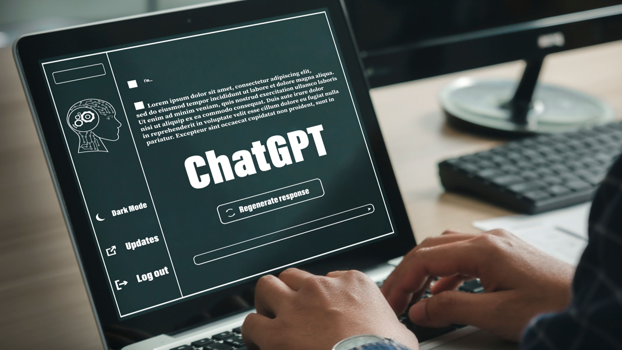 A man uses ChatGPT while typing on a computer