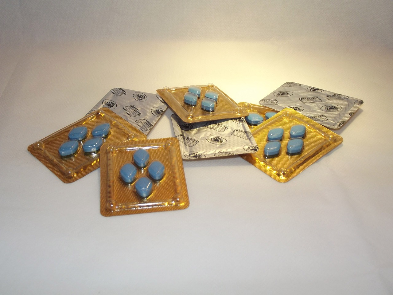 Blue Viagra pills in blister packs in sets of four