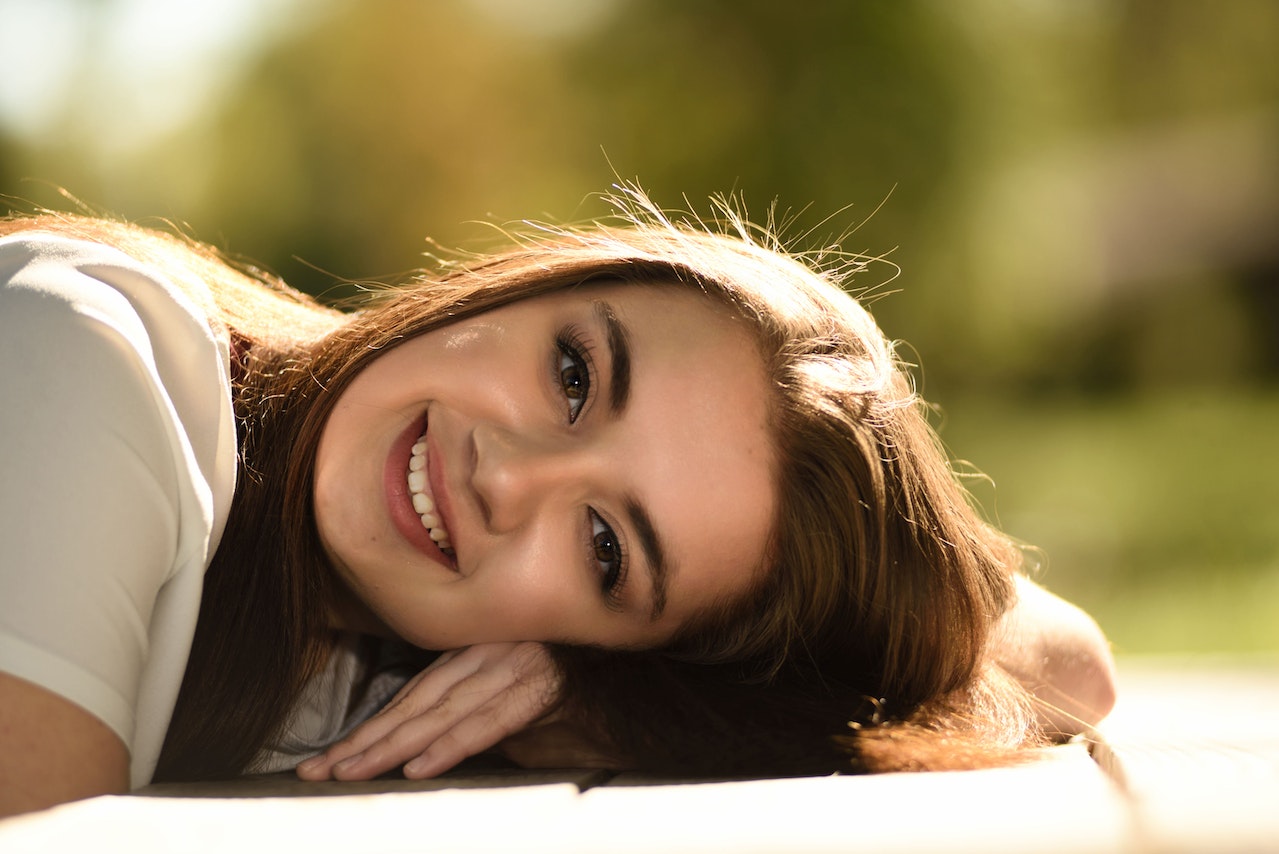 Woman smiling and laying down