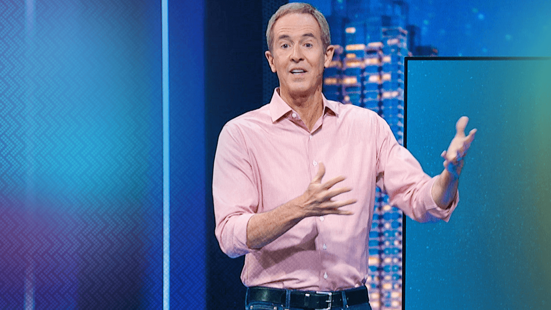 Andy Stanley wearing a pink shirt as he is preaching in a podcast