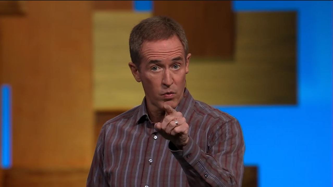 Andy Stanley wearing a brown shirt as he preaches