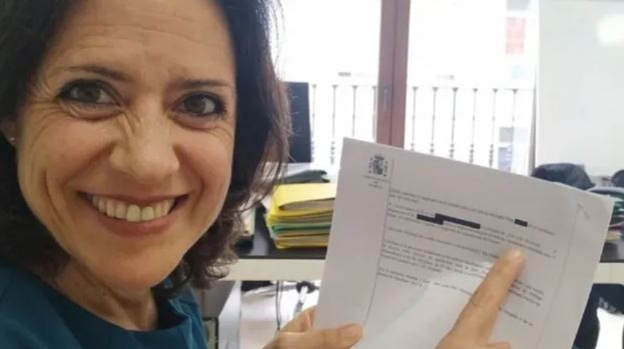Ivana Moral is happy while holding a document