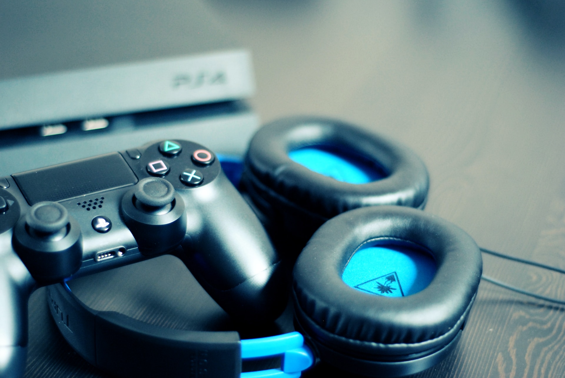 A PlayStation pad sitting on a blue headphone
