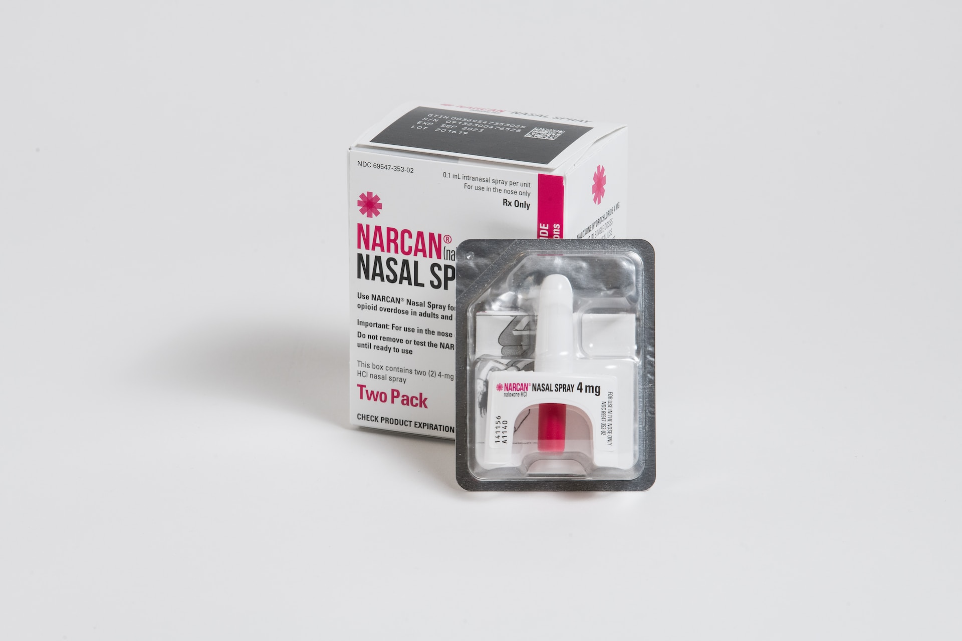 A two-pack box of Narcan nasal spray, with its white and red nasal spray inside a packet