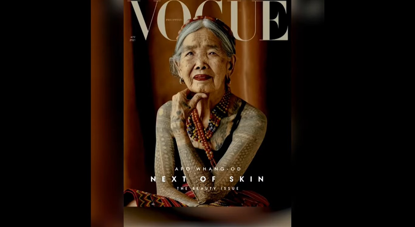 Apo Whang-od on Vogue Philippines cover showing off her tattoos in a black top and colorful tribal beads