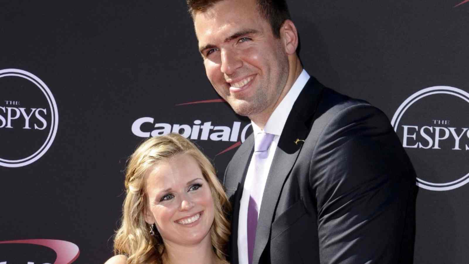 Dana Grady and her husband Joe Flacco at an event with a big smile on their faces