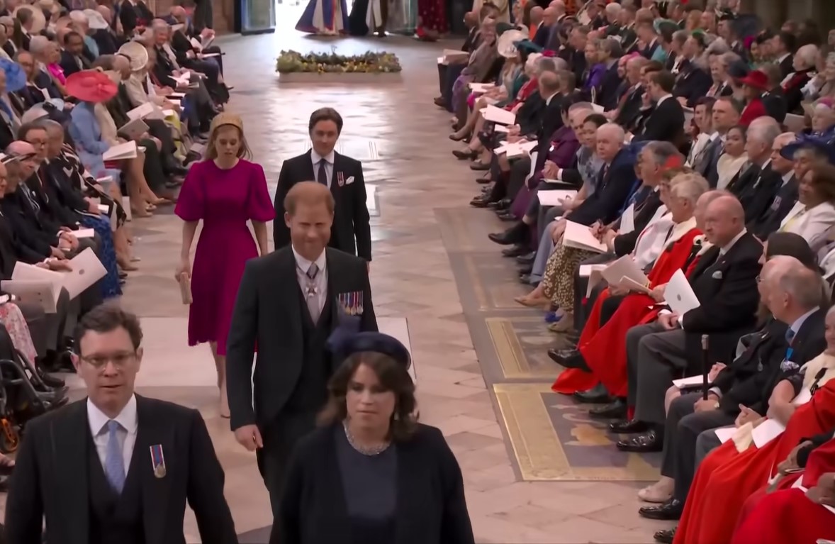 Prince Harry walking behind Princess Beatrice and her husband at the aisle of Westminster Abbey
