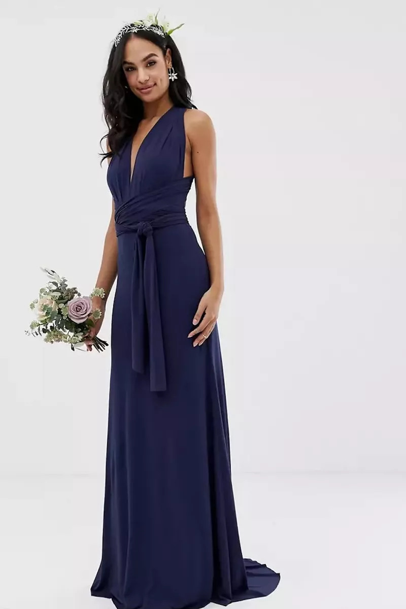 A Bridesmaid Wearing A TFNC Multi-Way Maxi Dress And Flower Crown