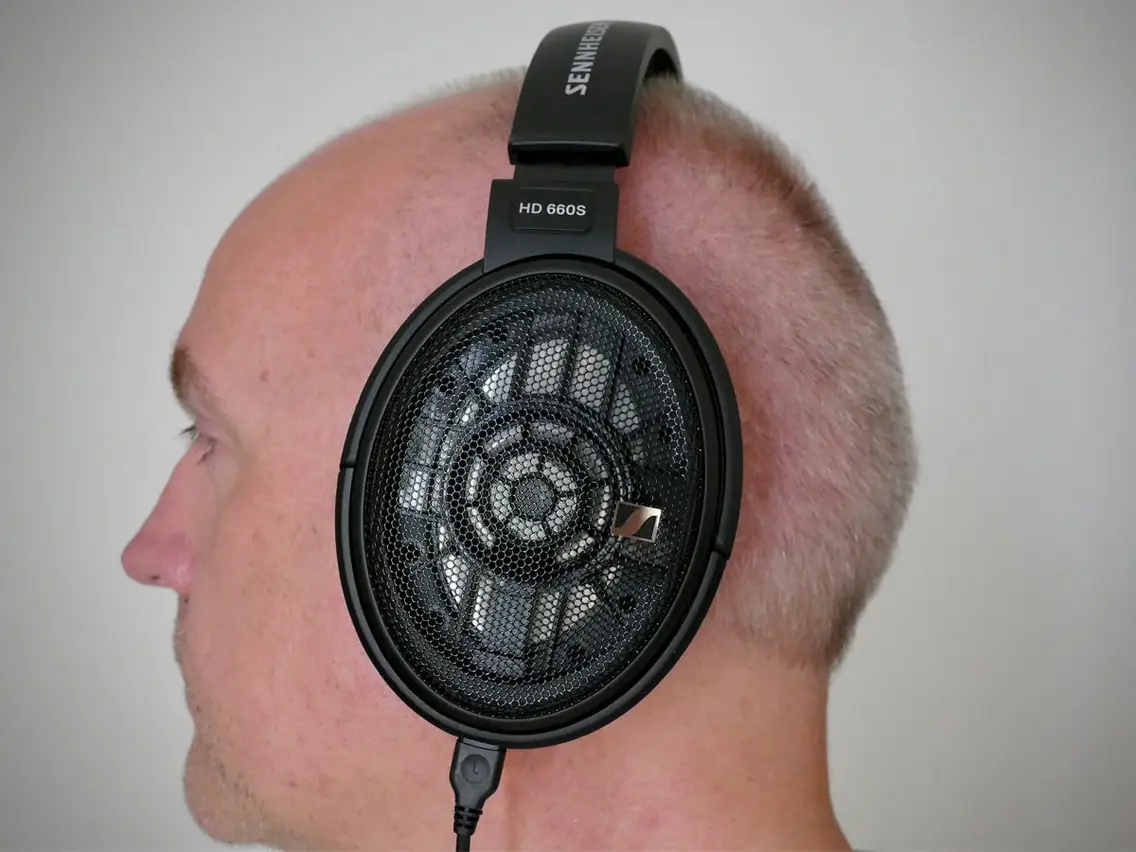 A man wearing Sennheiser HD 660 S headset