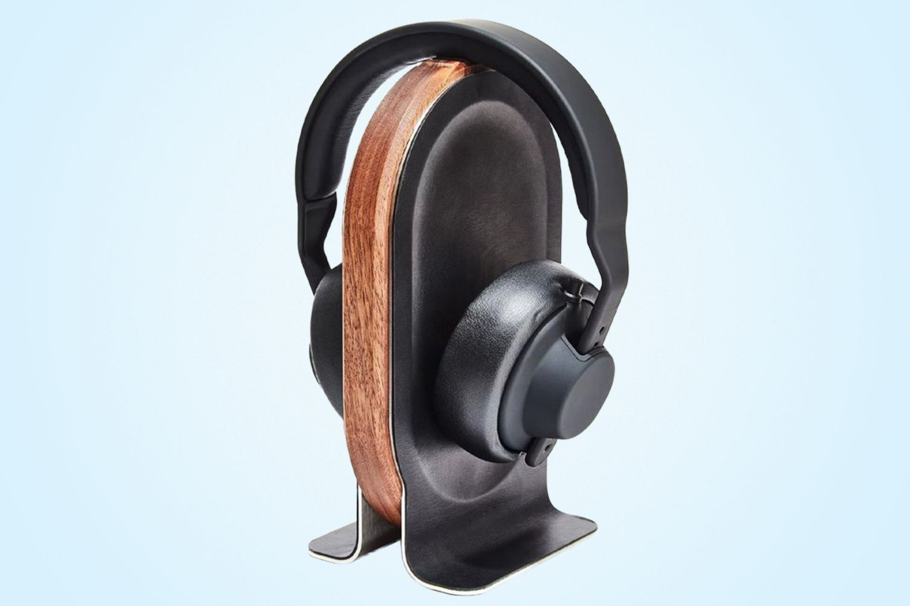 An image of a headphone stand with a headphone resting on it