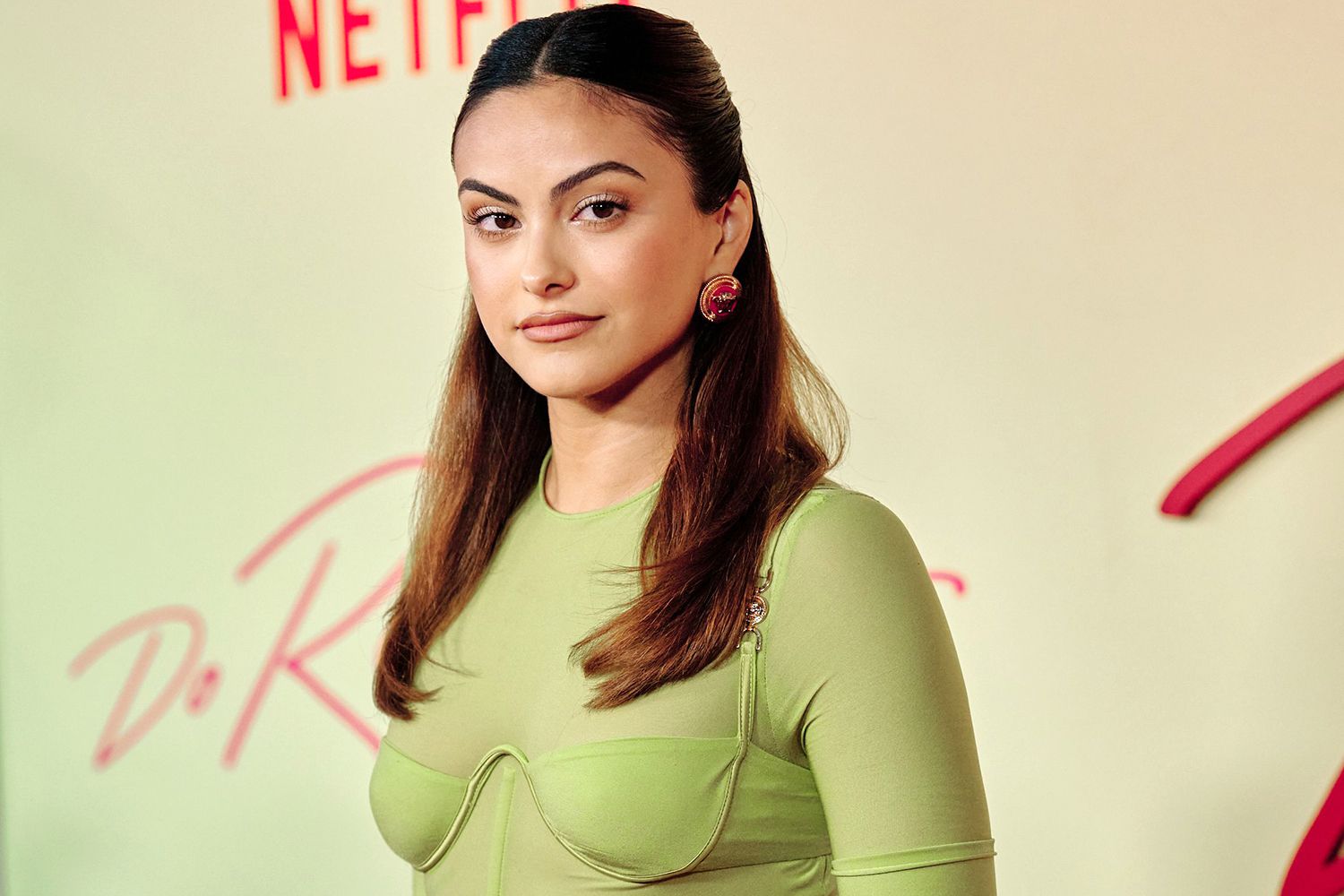 Camila Mendes wearing a green dress