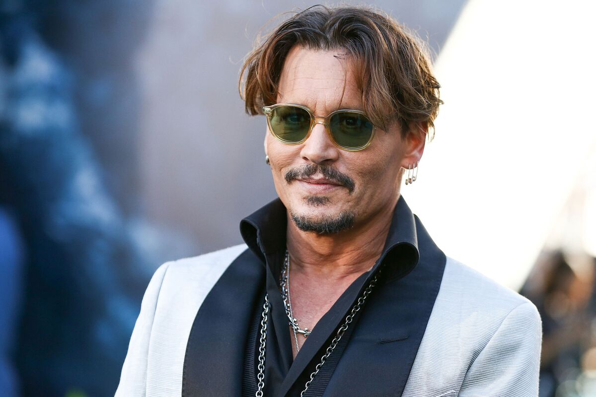Johnny Depp wearing a gray suit