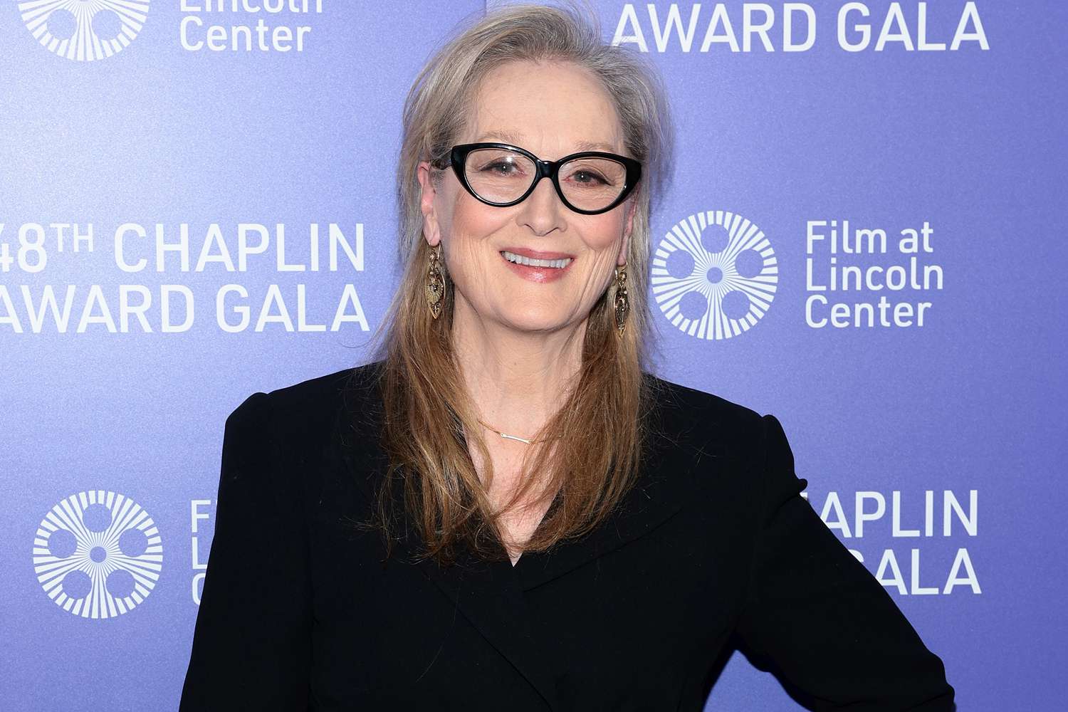 Meryl Streep wearing a black coat