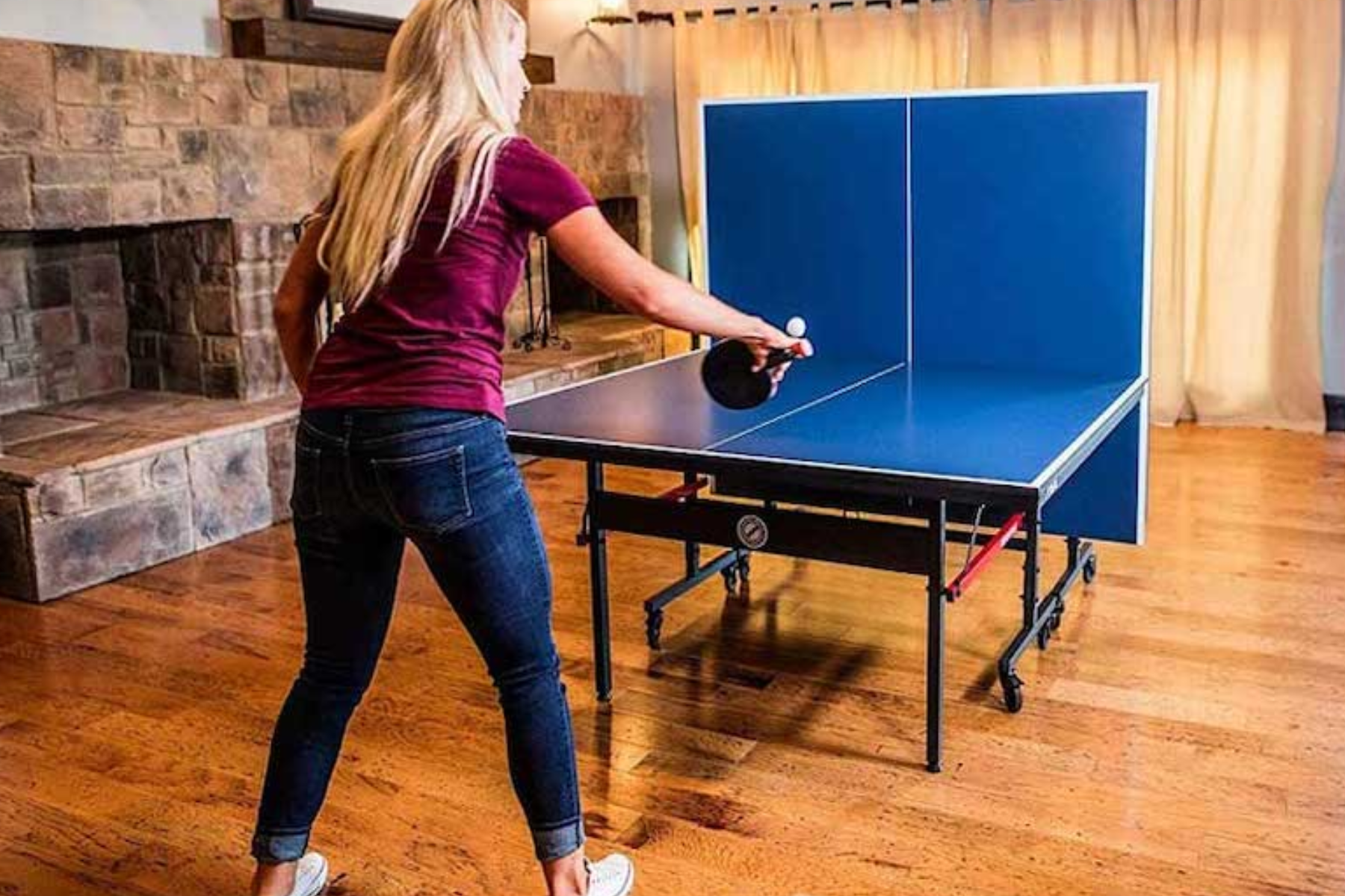 A solo female player engaged in a game of ping-pong