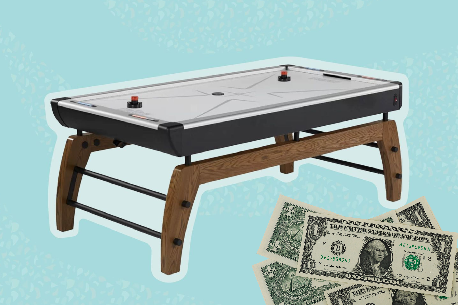 An air hockey table in the background with scattered dollar bills
