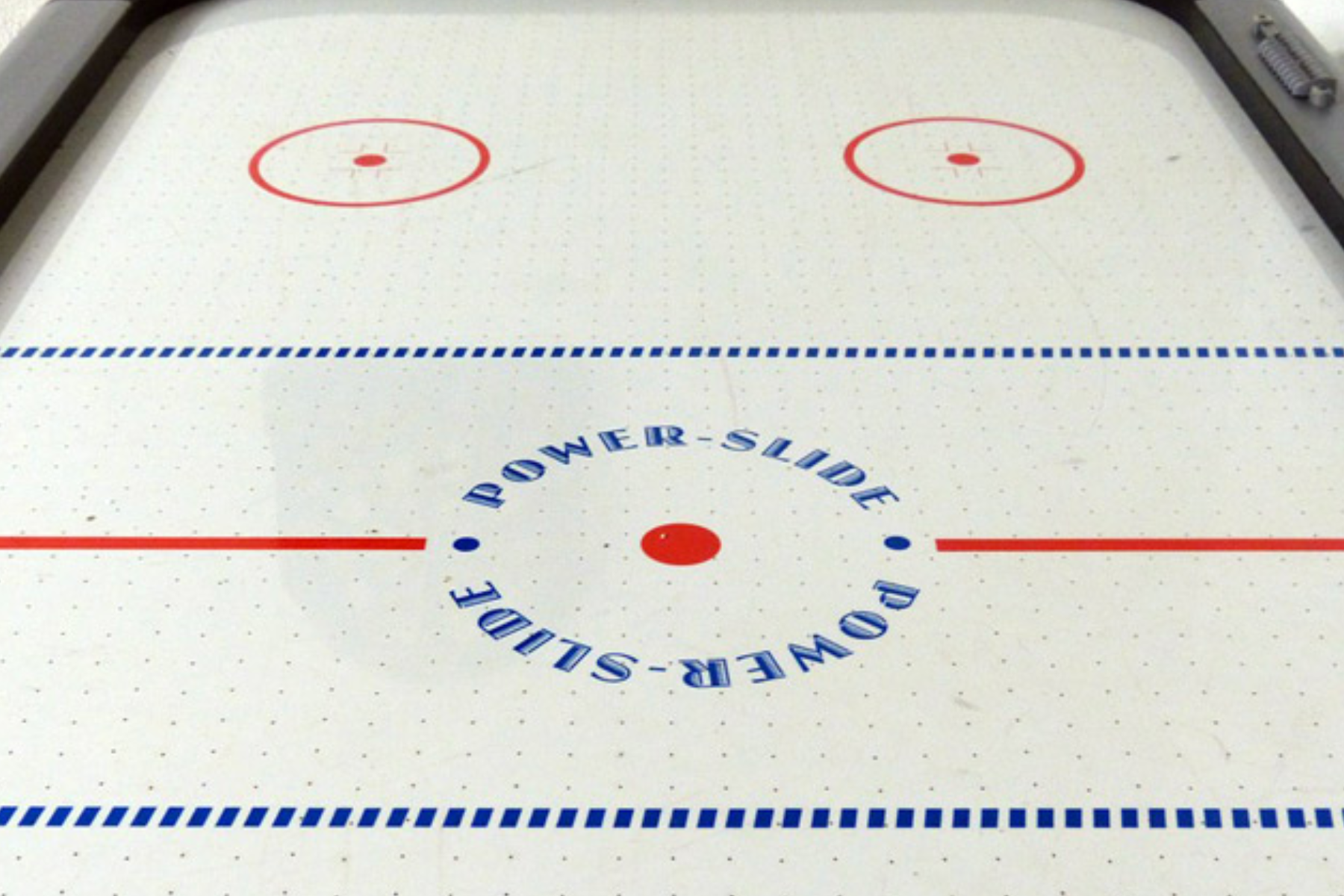 A view of the surface of an air hockey table