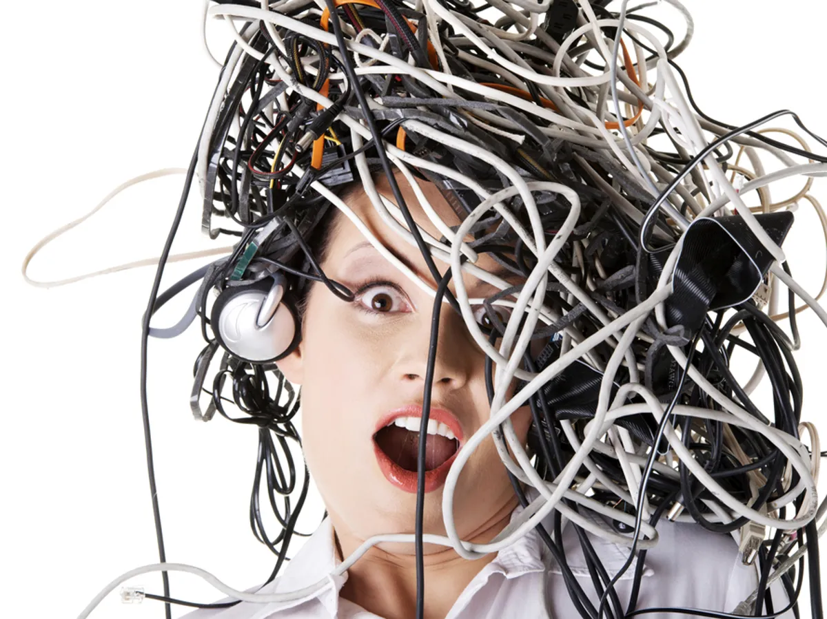 A woman with tangled wires on her head