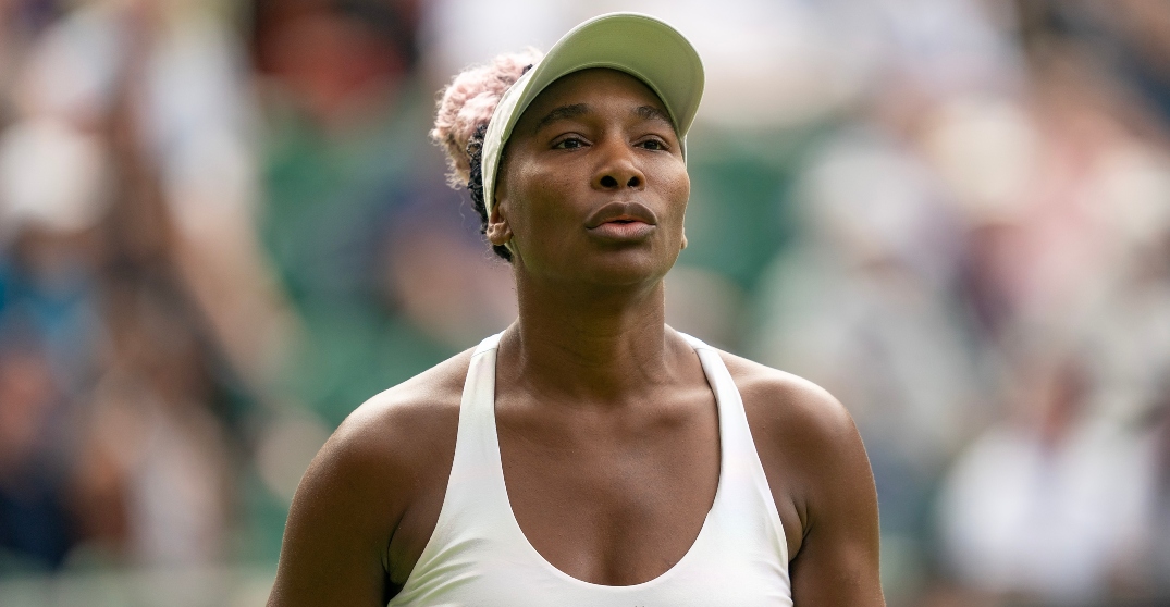 Venus Williams wearing a white spoorts bran and tennis cap
