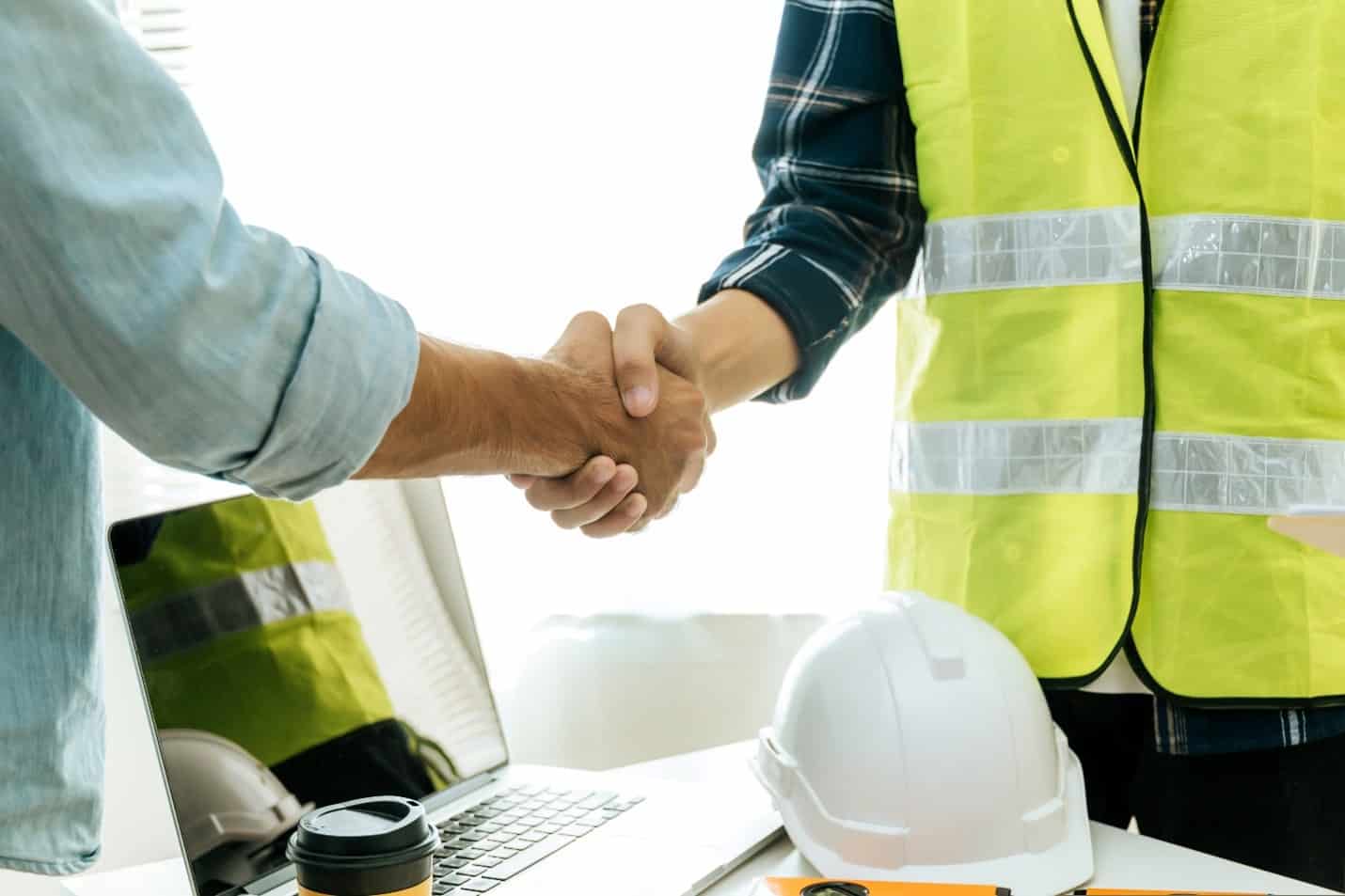 Boss and worker shaking hand