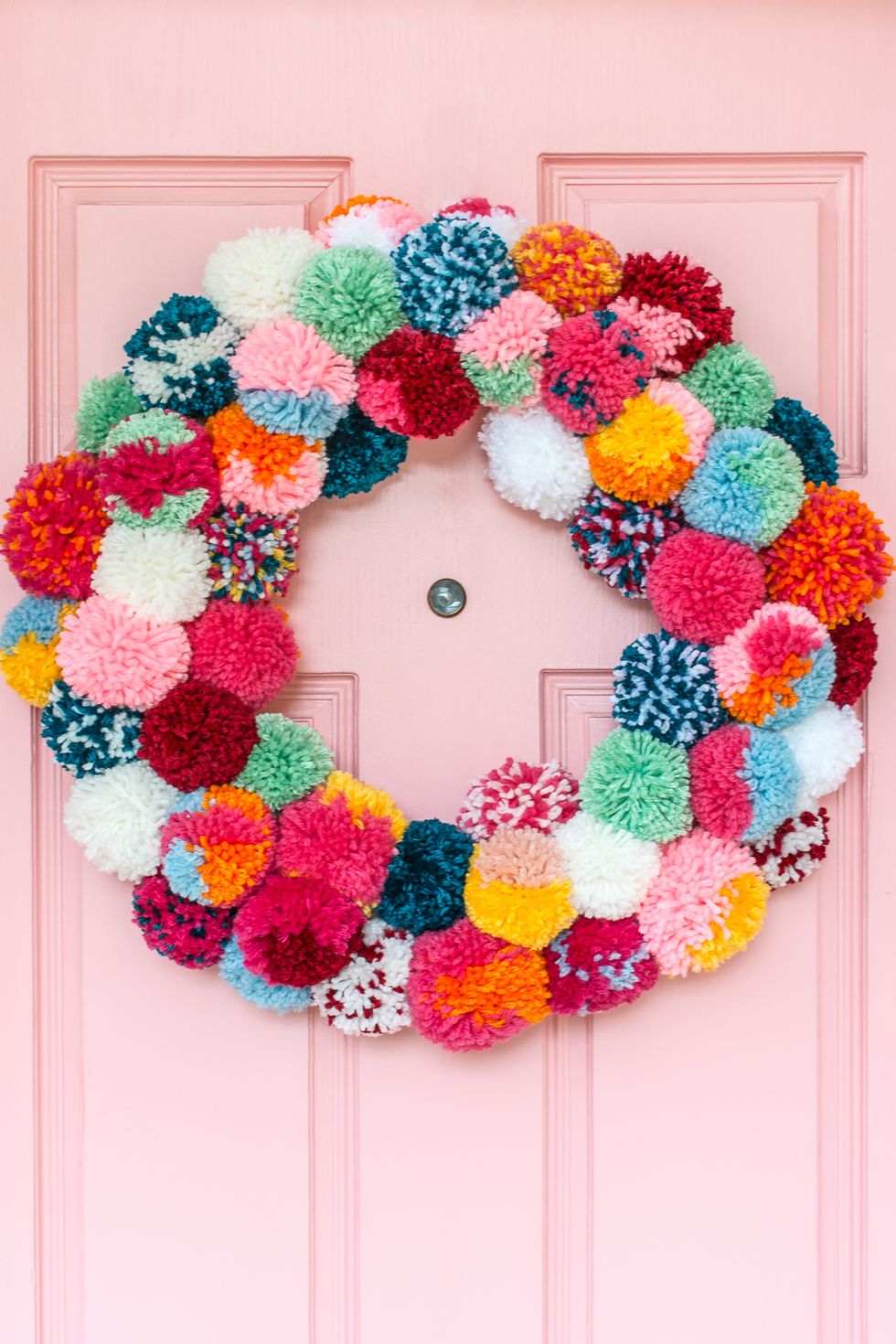 Colorful christmas wreath made out of pompoms