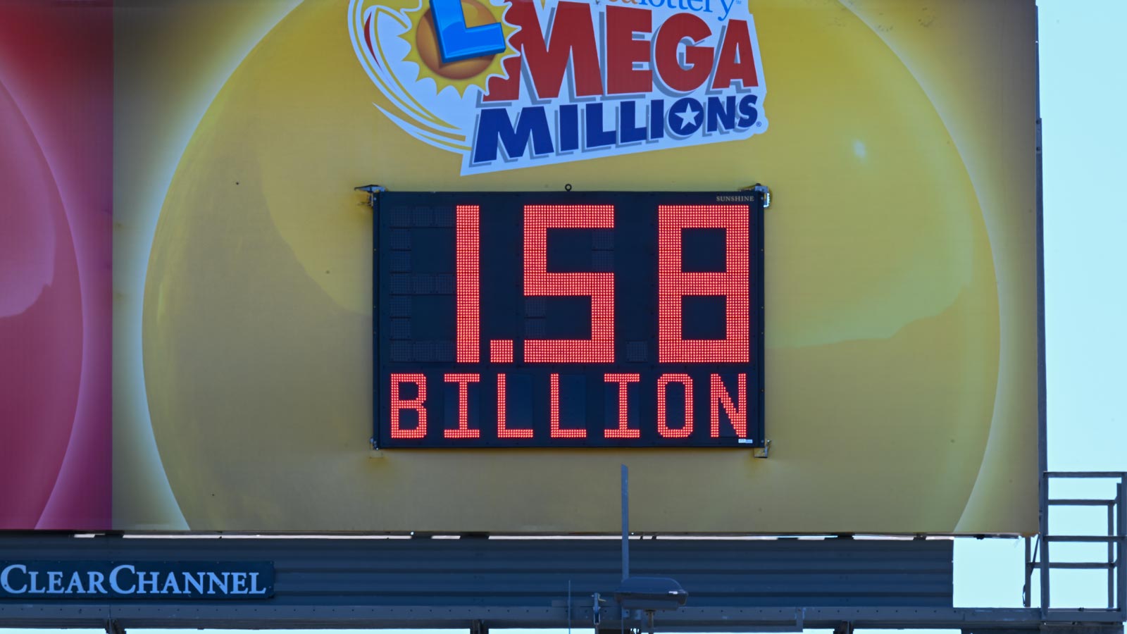The highest prize yet of $1.58 Billion written on Mega Millions bilboard sign