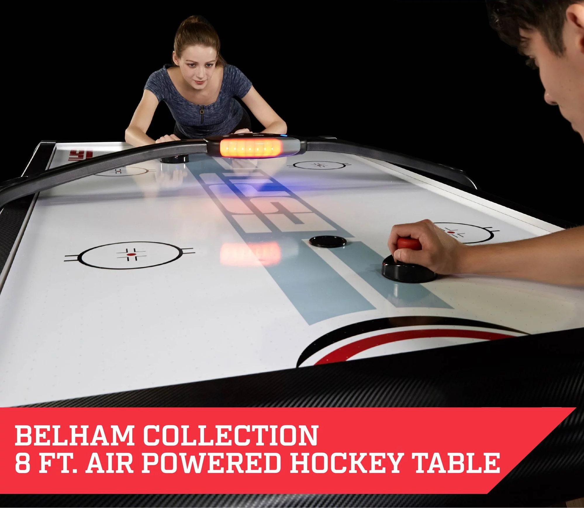 Two persons playing on ESPN Belham Collection 8 Ft. Air Powered Hockey Table