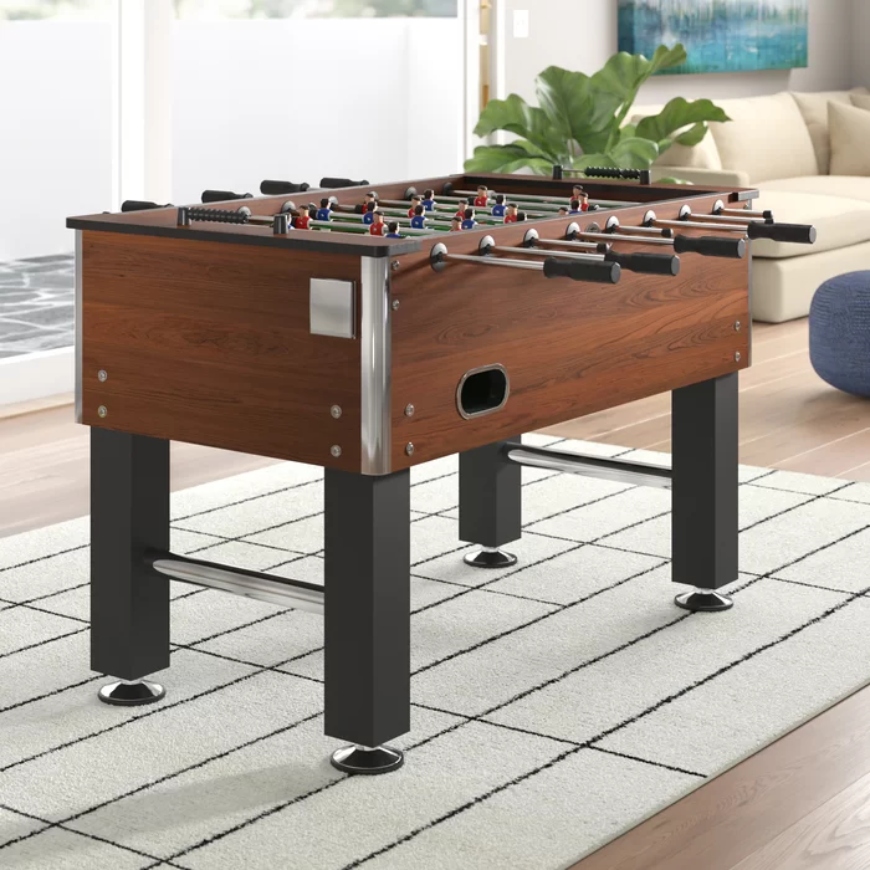 Christopher Arlmont & Co. 55.25'' L Foosball Table in a room