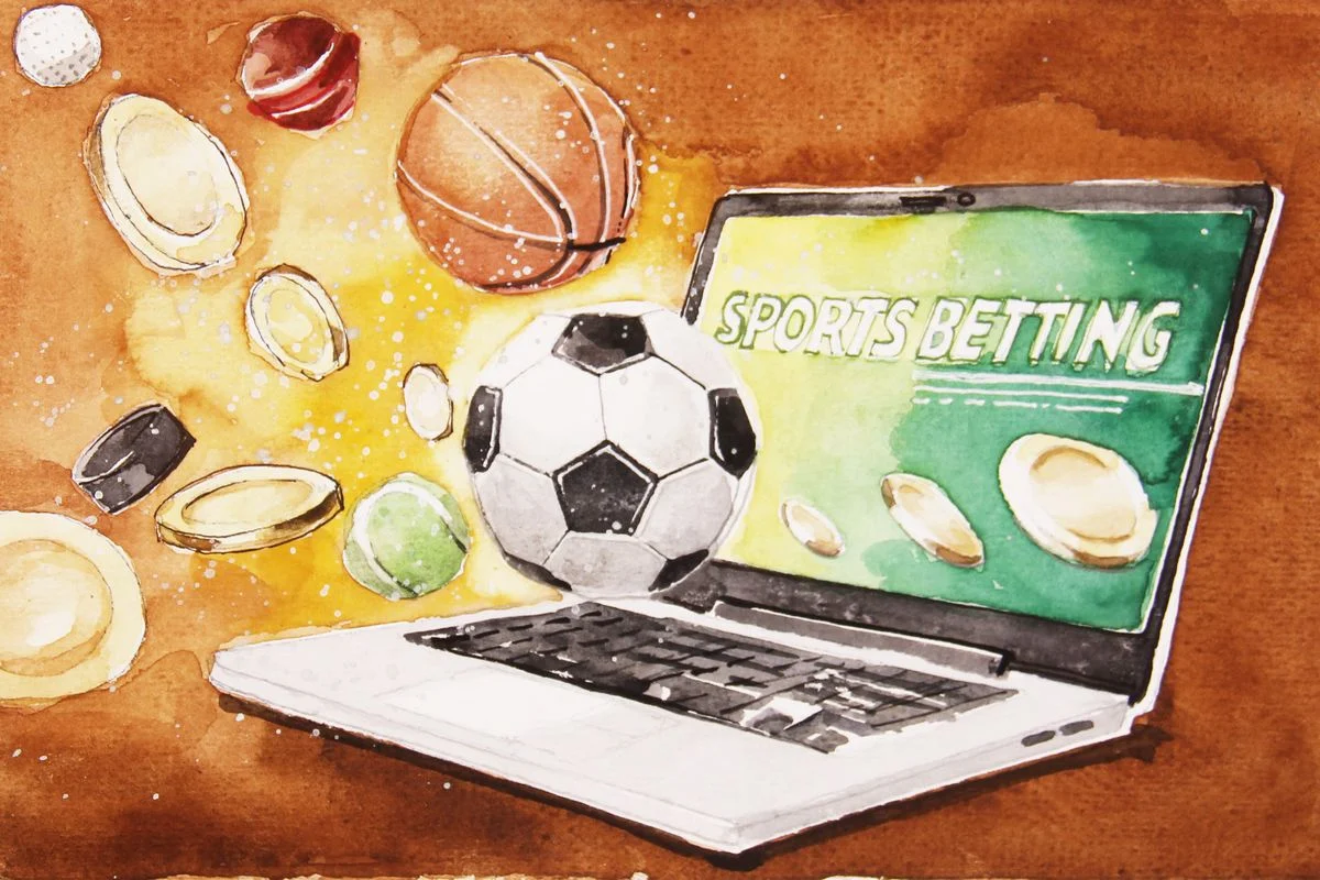 A laptop screen is displaying sports betting while balls and gold coins are outside the laptop.