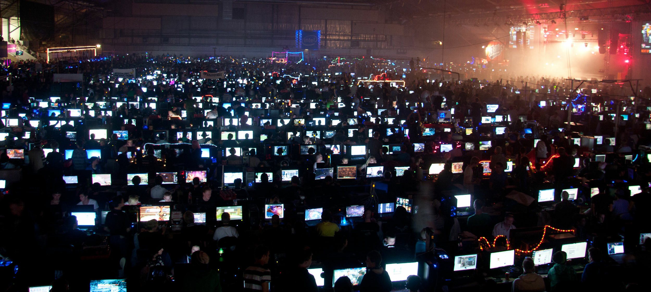 Hundreds of people playing video games on computers in front of them
