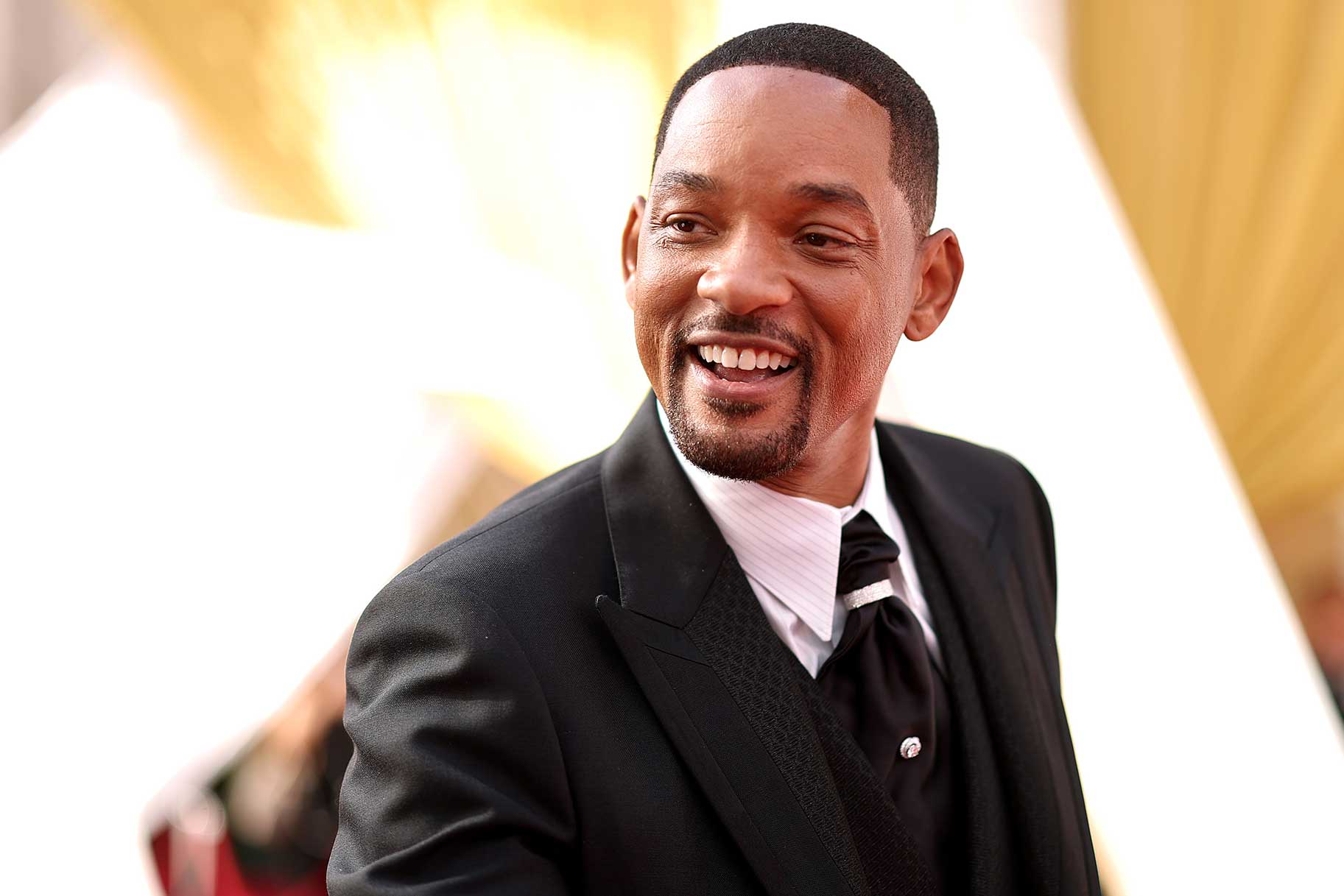 Will Smith wearing a black suit