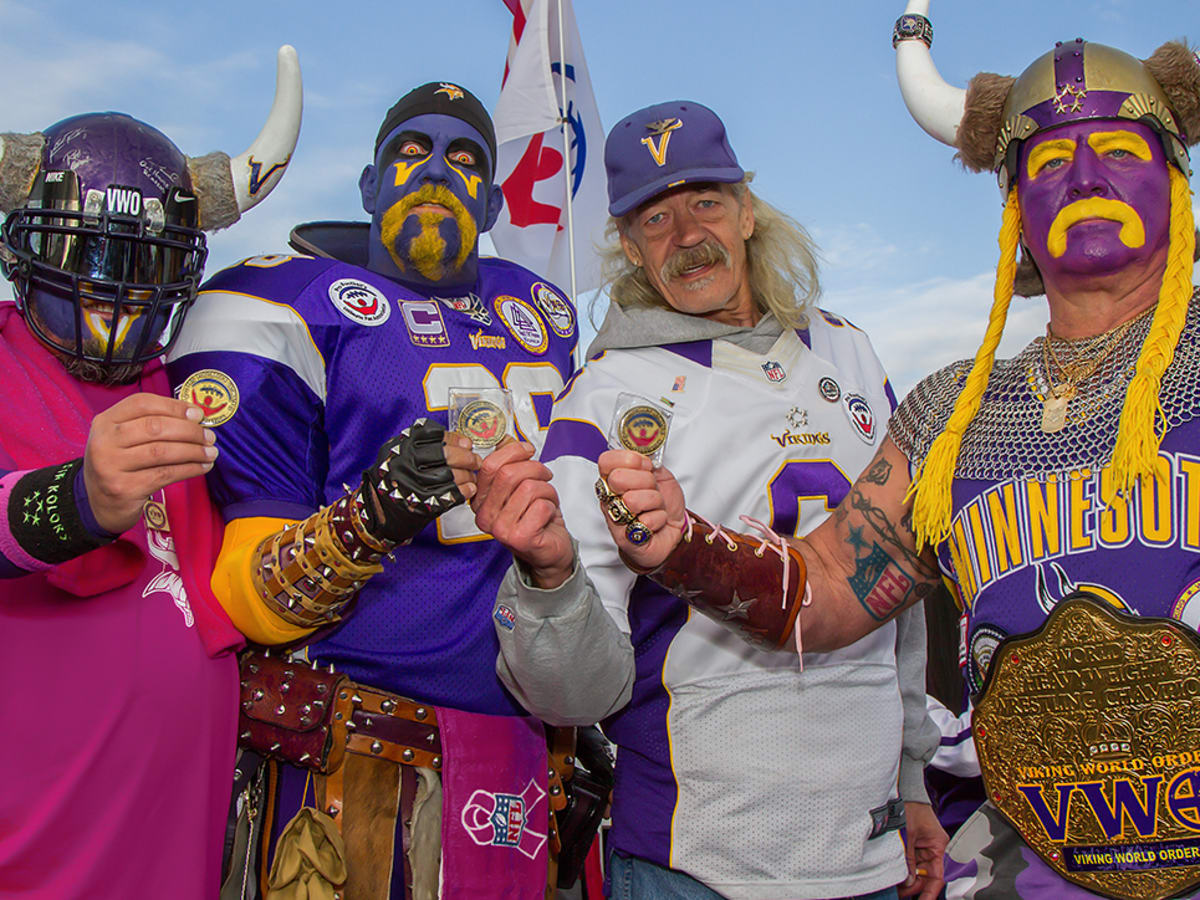 Vikings fans in makeup showing there badges