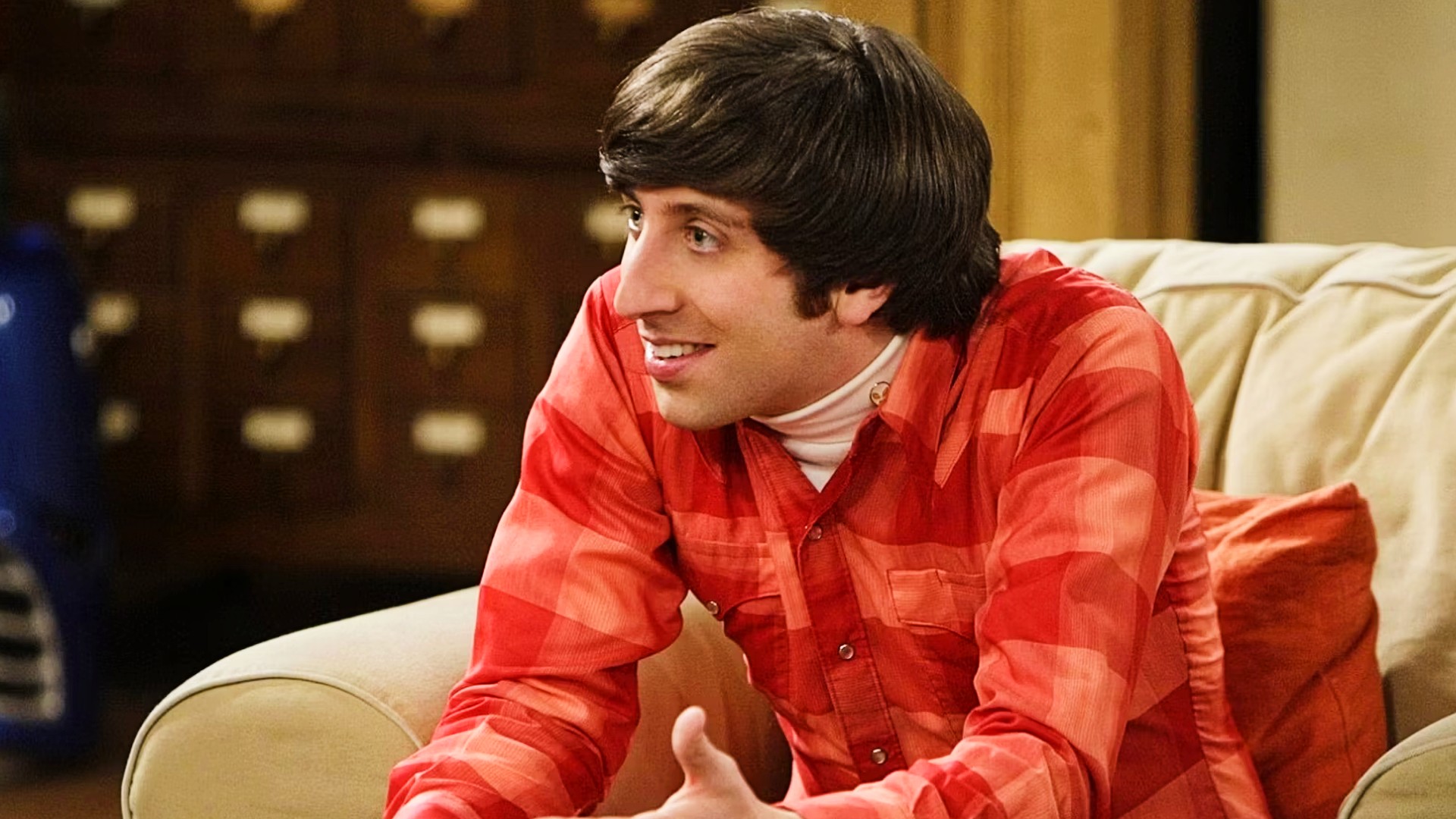 Simon Helberg as Howard Wolowitz wearing a red plaid polo