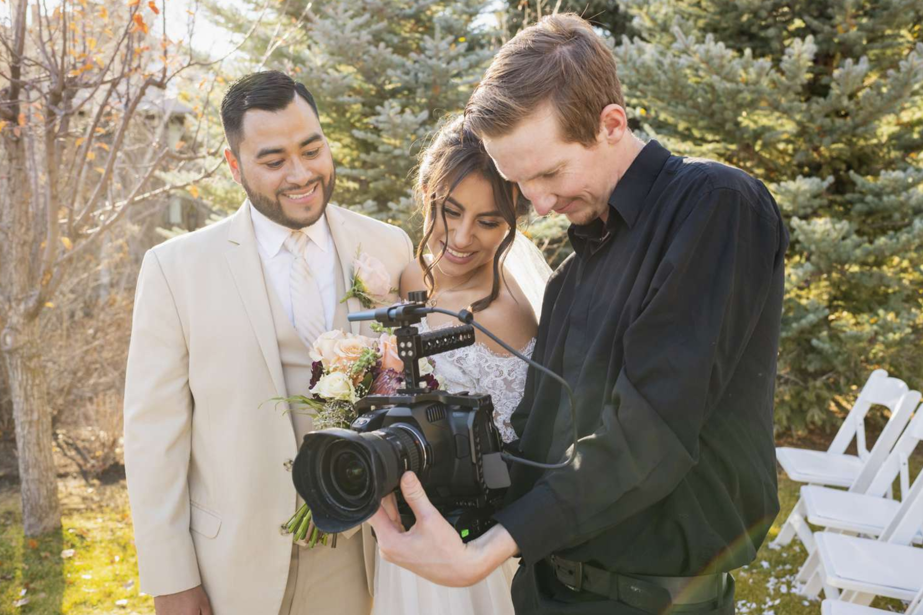 A couple and the photographer for their engagement photoshoot