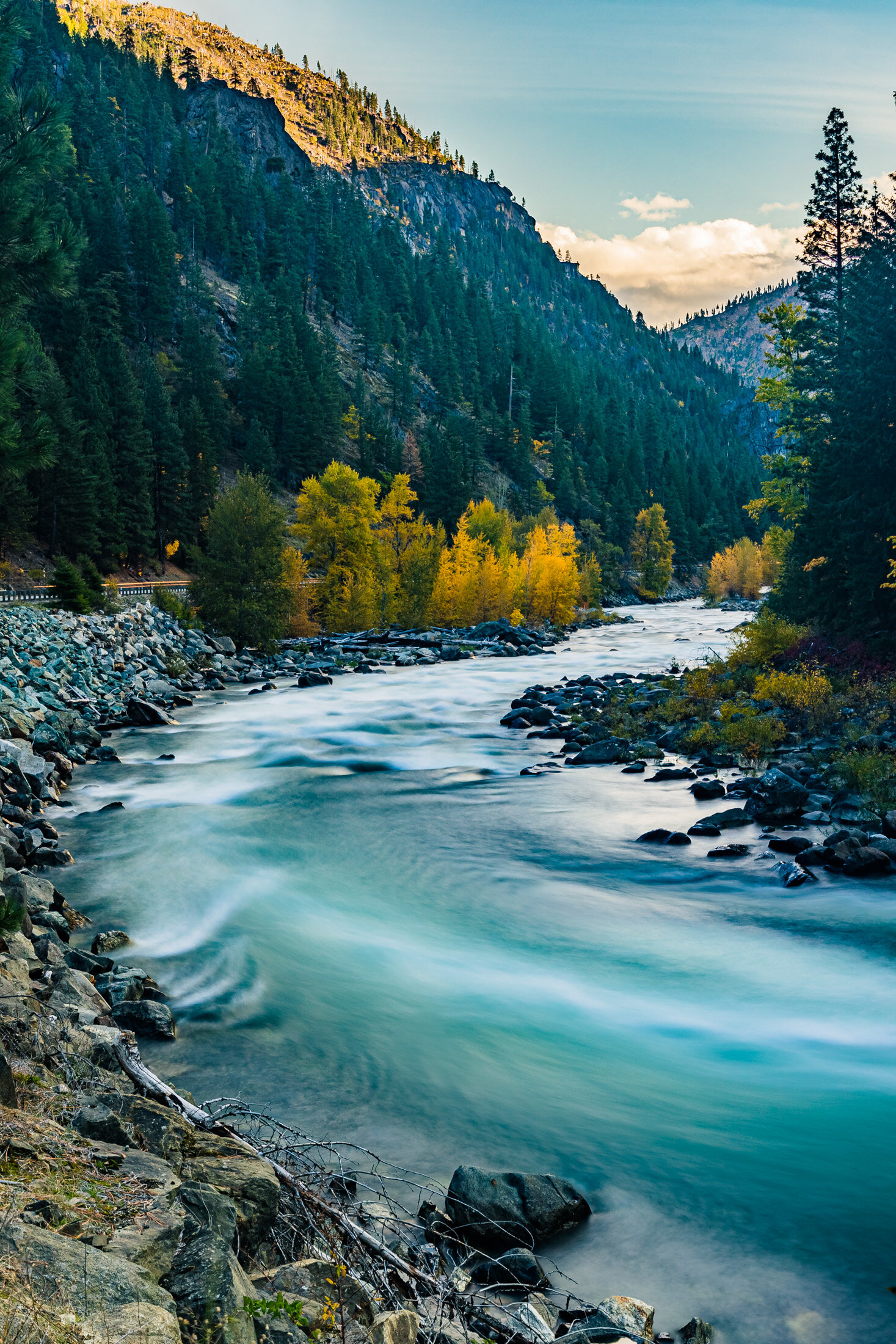 River flowing surrounded by beautiful mountains and trees 