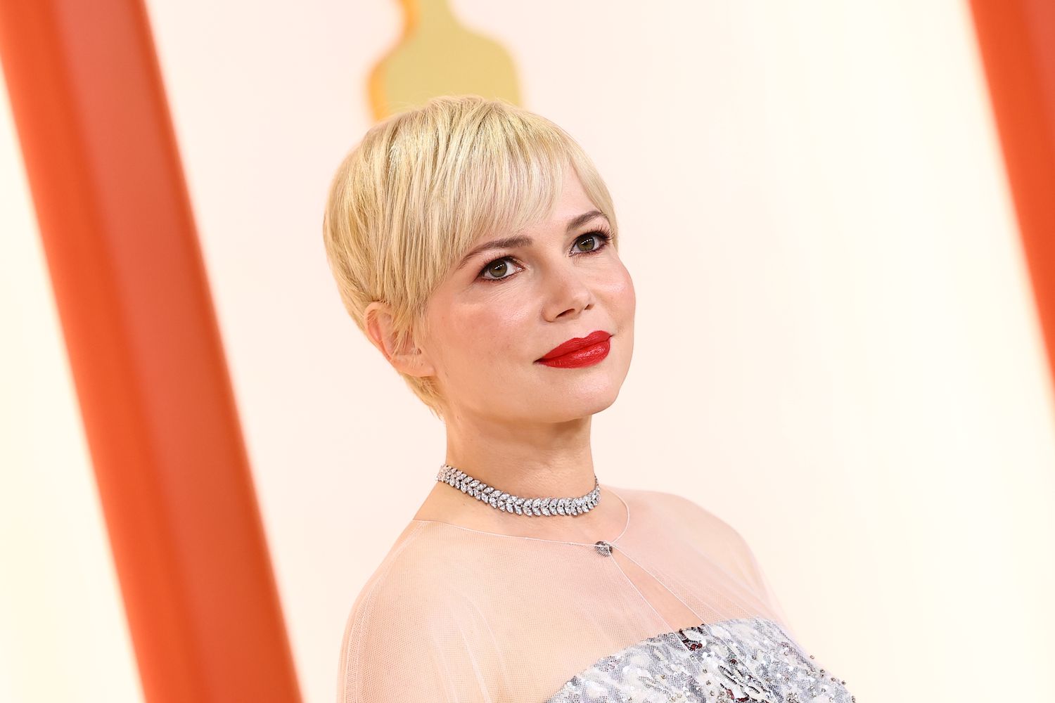 Michelle Williams wearing a silver dress