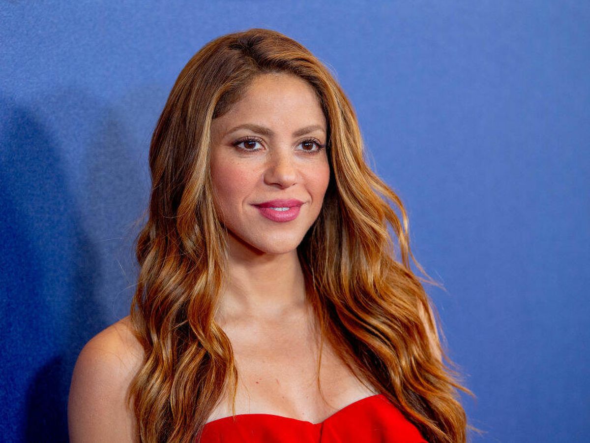 Shakira wearing a red dress