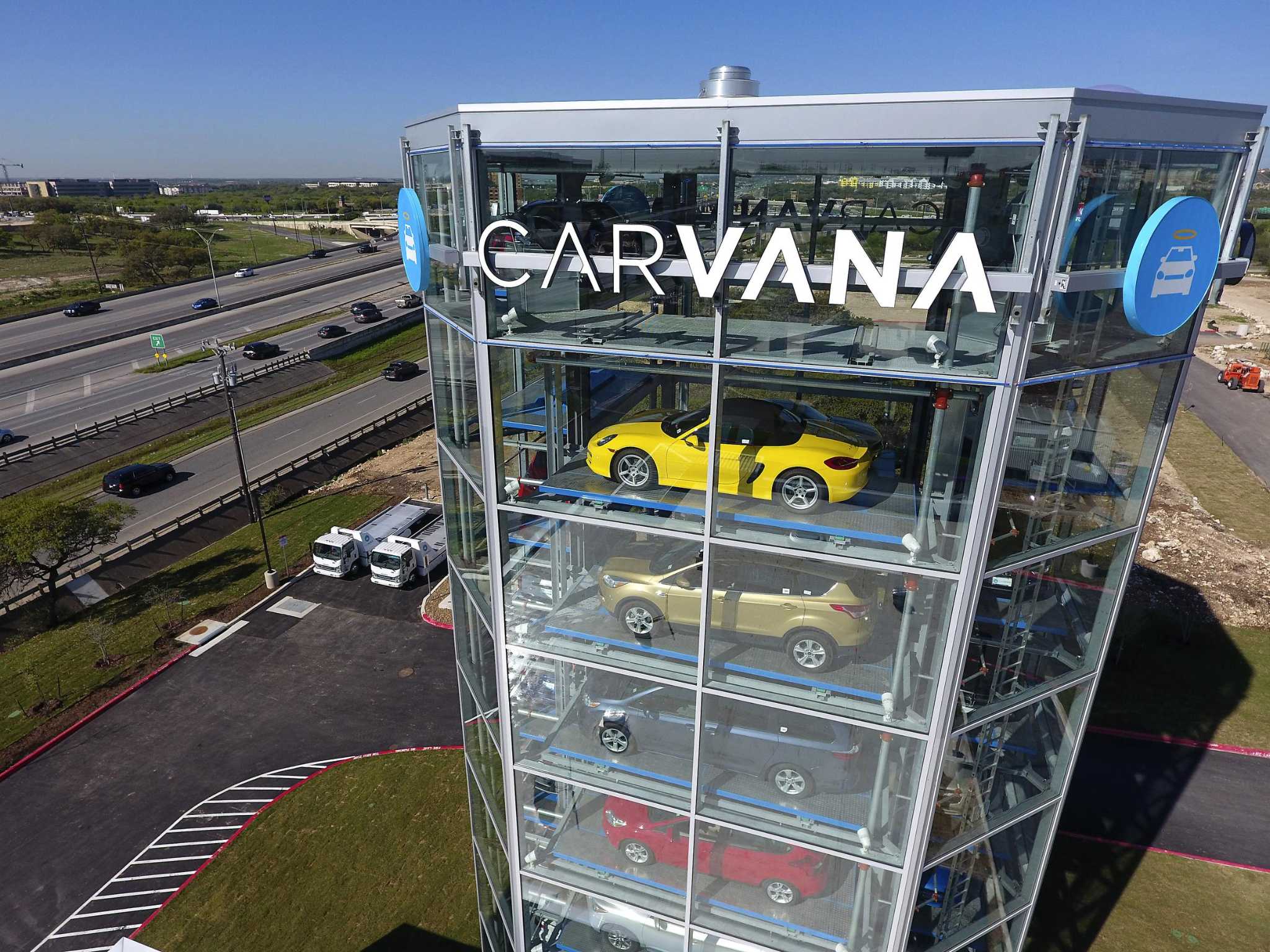 Parking lot building with a huge Carvana Written on it