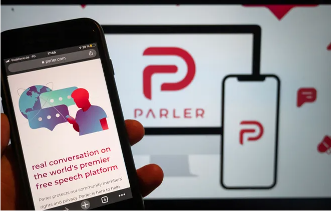 Parler return and human hand hold moblie with parler app preview