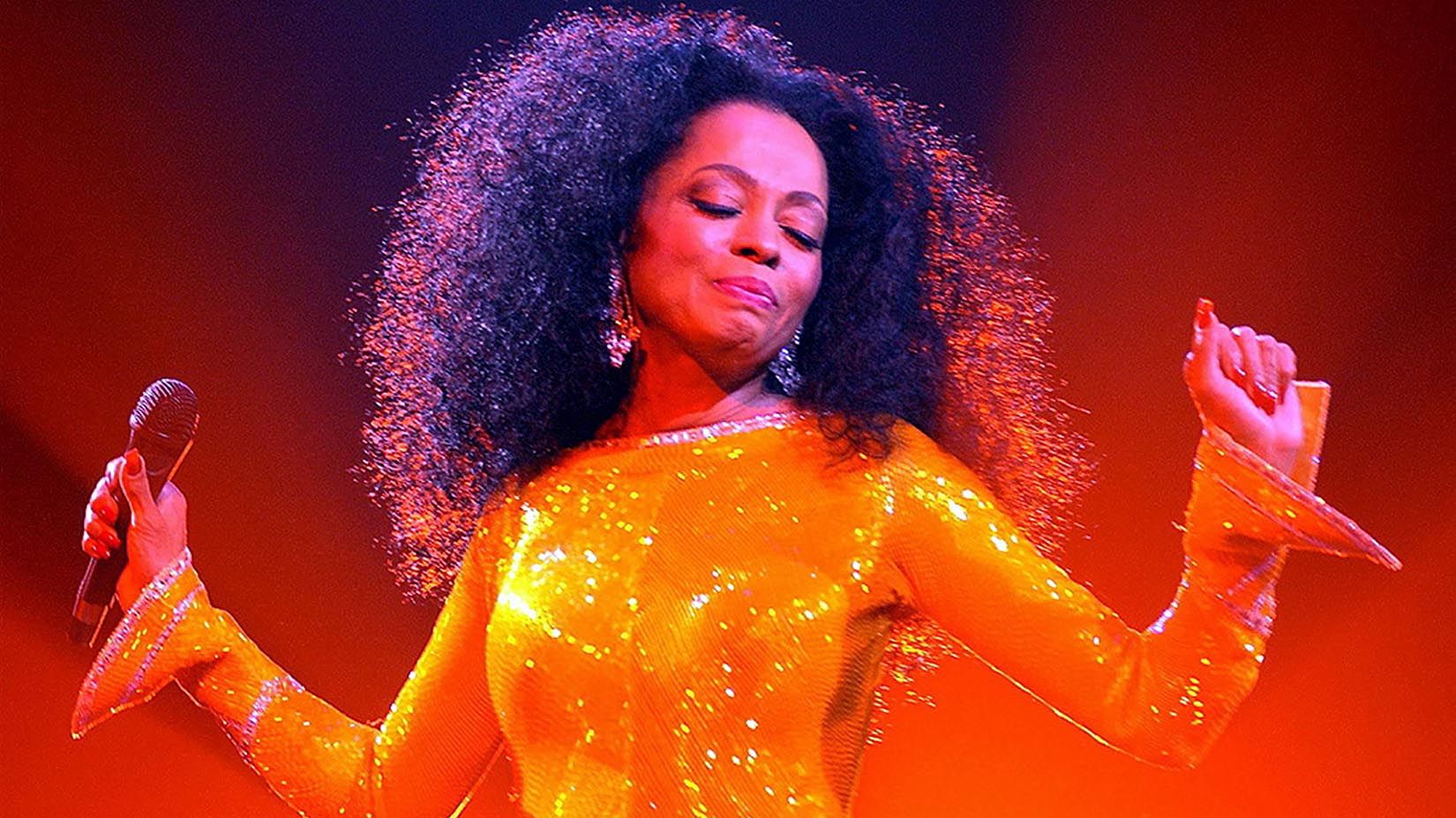 Diana Ross wearing a yellow suit