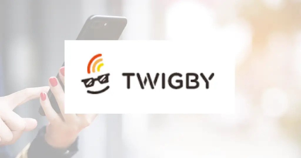 The Twigby logo with a person holding a phonne in the background