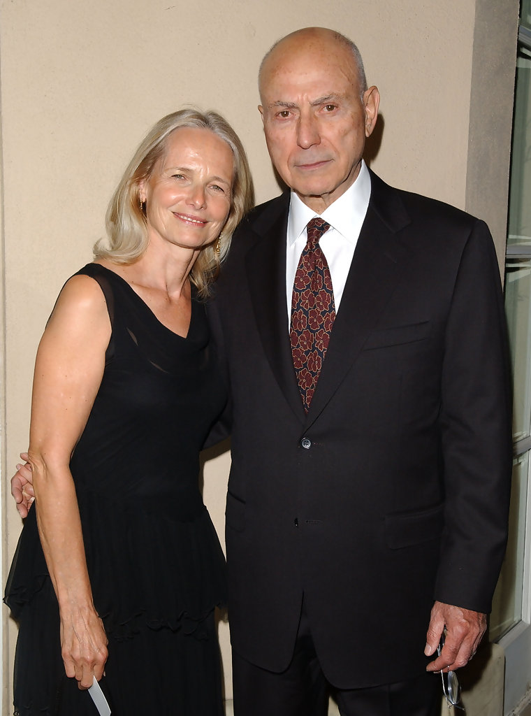Jeremy Yaffe smiling while wearing a black dress and Alan Arkin wearing a black suit