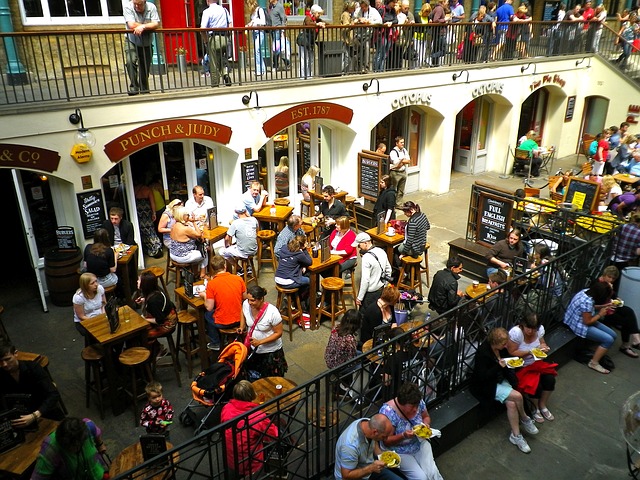 People socializing and dining at Covent Garden Market in downtown London, England