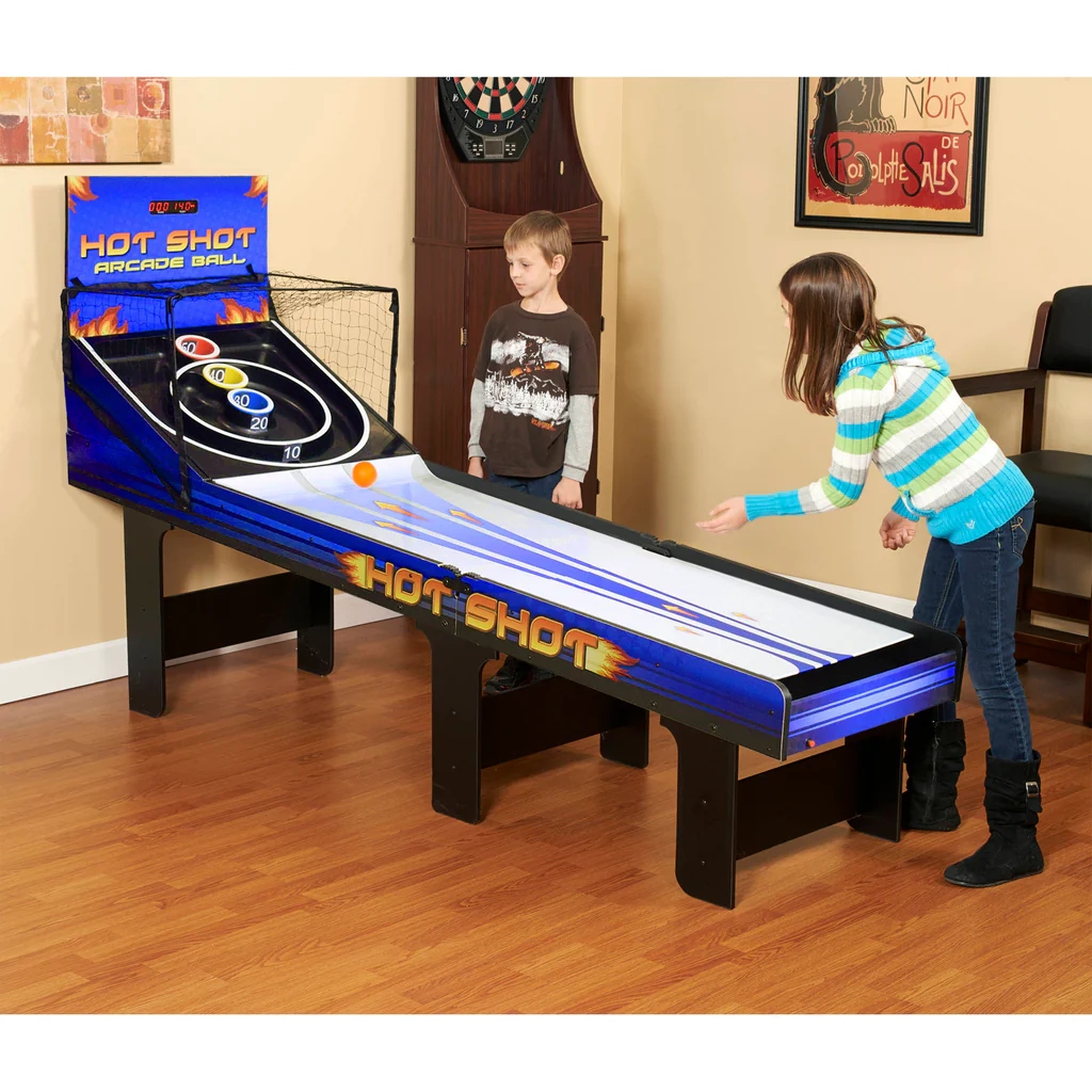 Two kids playing with Hathaway Hot Shot 8 Ft Arcade Ball Table