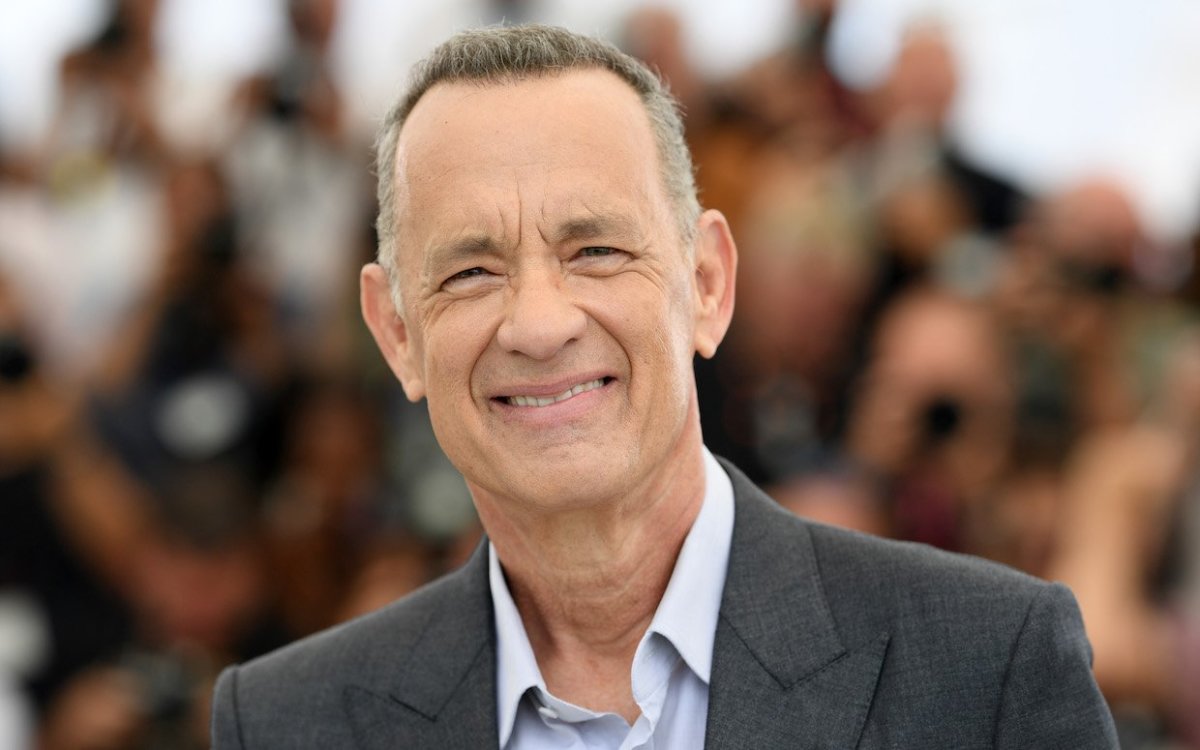 Tom Hanks wearing a dark gray coat