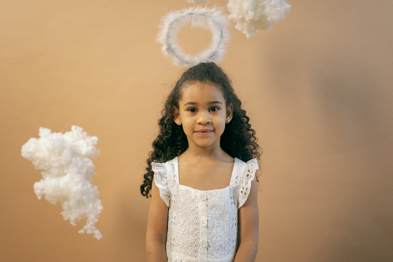 Adorable Black Girl in Angel Outfit With Nimbus