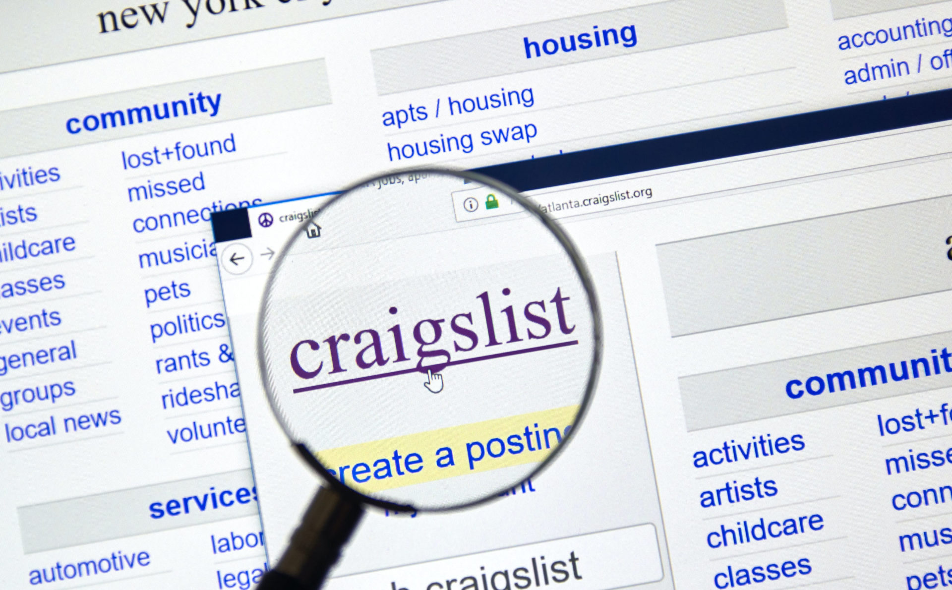 A magnified view of the Craigslist website, focusing on its logo and the "create a posting" option, with categories like community, housing, and jobs visible in the background.