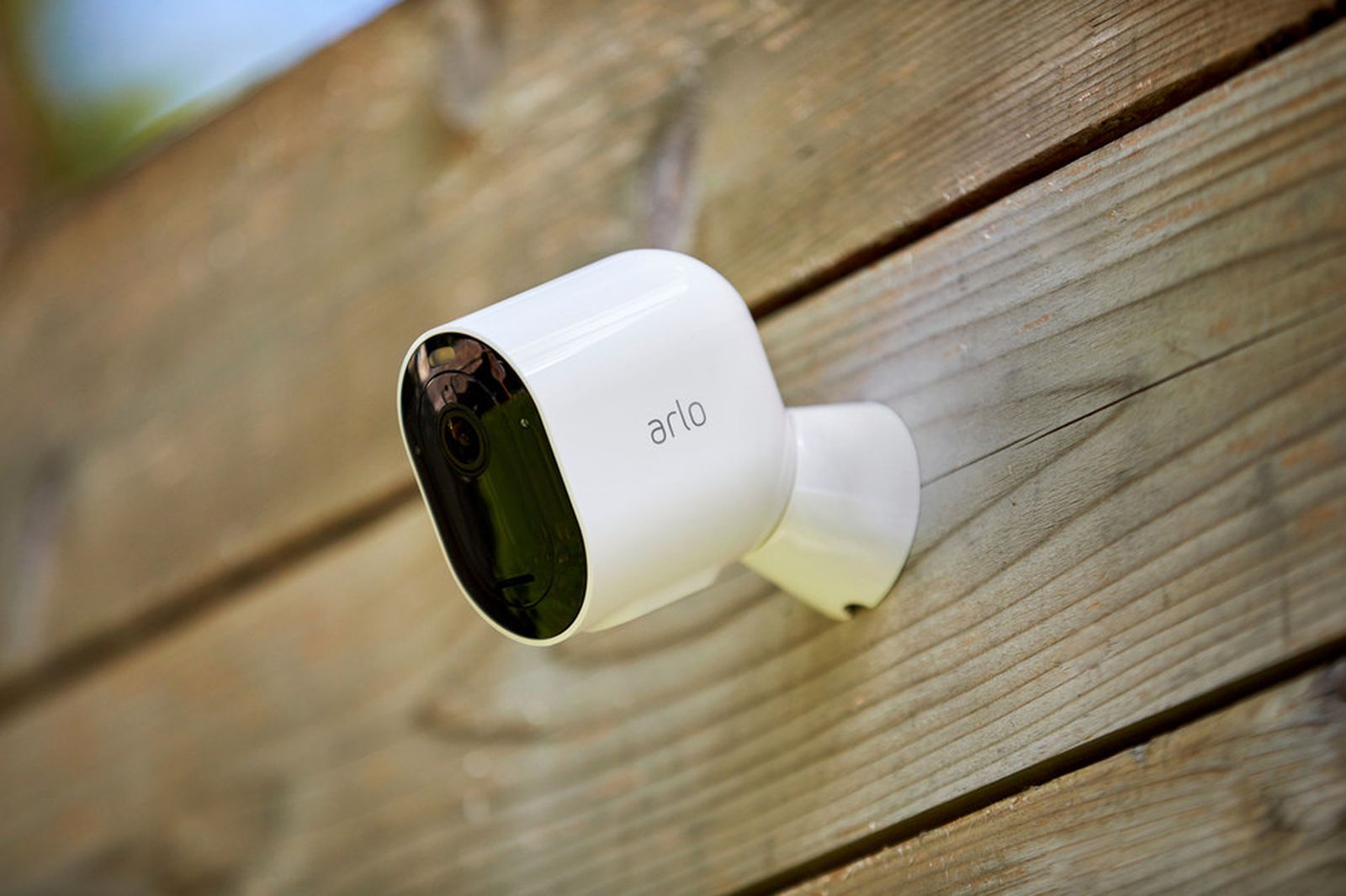 White security camera on a wood