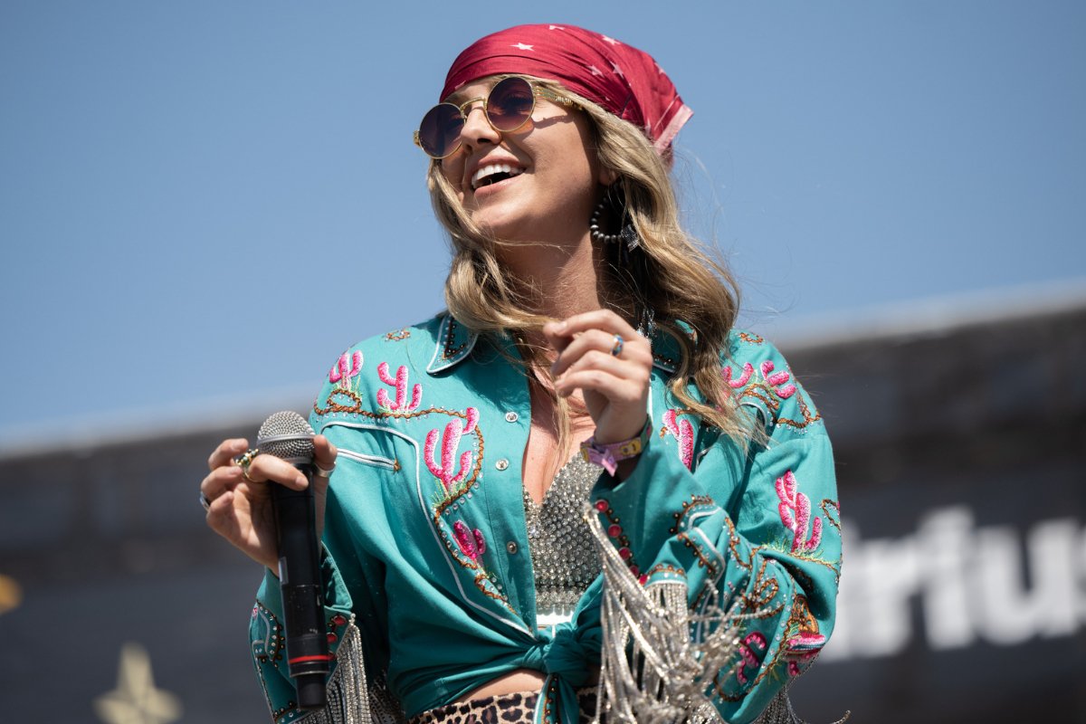 A girl is wearing bandana in a music festival