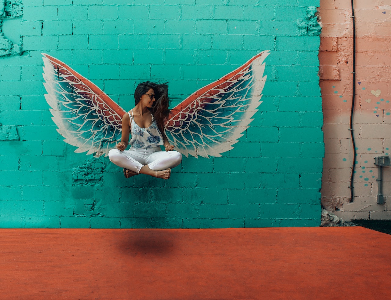 Woman Beside Wings Decor art on wall